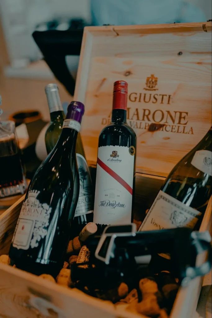 A case of fine wines symbolizing the modern era of wine as an investment asset alongside text about its financial appeal