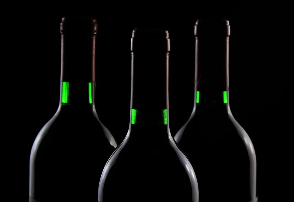 A curated selection of fine wines from renowned vineyards, symbolizing a journey from ancient trade to modern investment.