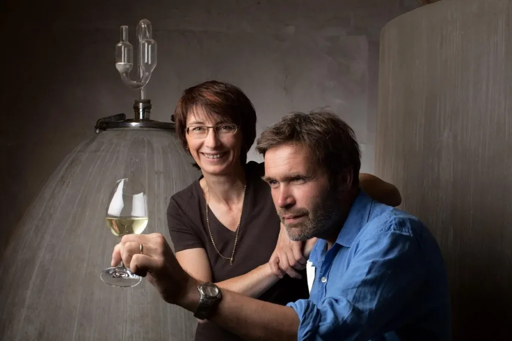 A heartwarming portrait of the Trapet family, showcasing the husband and wife duo who contribute passionately to the art of winemaking